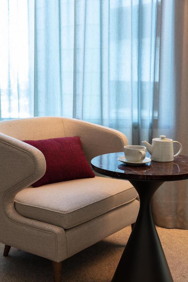 Next Hotel Melbourne, Curio Collection By Hilton Exterior foto A tea set